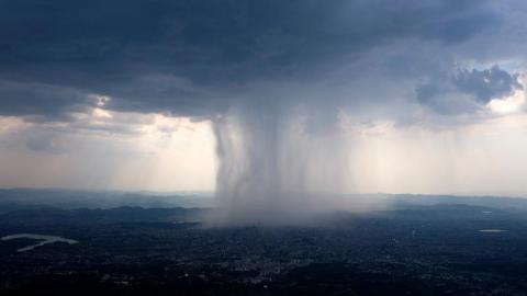 Rain storm over a village aerial image