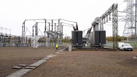 Power transformer and a worker in Scotland, UK