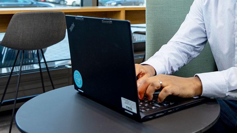Typing on a laptop